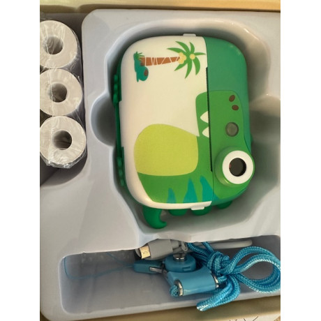 Detský fotoaparát s termotlačiarňou na okamžitú tlač, motív dinosaura. Zelená farba.